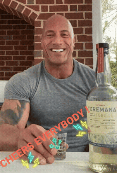 A Man Holding A Shot Glass Next To A Bottle Of Tequila That Says " Cheers Everybody " GIF