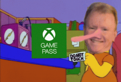 A Man Holding A Sign That Says Do Not Touch In Front Of An Xbox Logo GIF