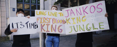 A Man Holding A Sign That Says Long Live The Jankos Of The First Blocking Of The Jungle GIF