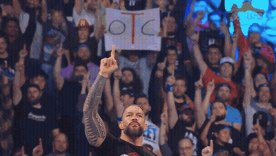 A Man Holding A Sign That Says Otc In Front Of A Crowd GIF