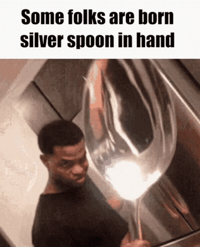 A Man Holding A Silver Spoon In His Hand With The Caption Some Folks Are Born Silver Spoon In Hand GIF