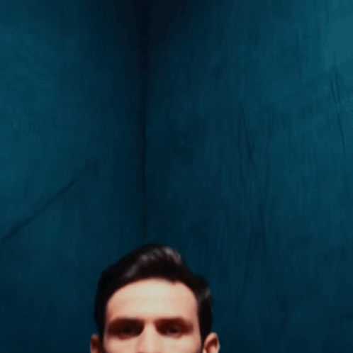 A Man Holding A Soccer Ball That Says Air Way On It GIF