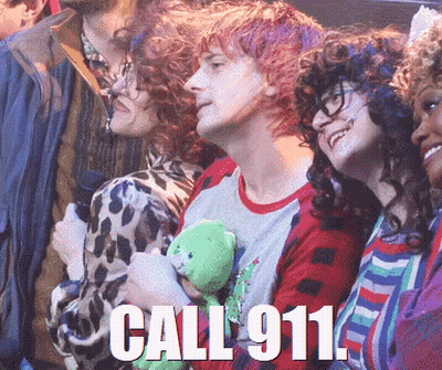 A Man Holding A Teddy Bear With The Words Call 911 On The Bottom GIF