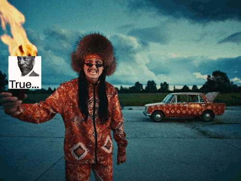 A Man Holding A Torch With A Picture Of A Man Behind Him And The Word True GIF