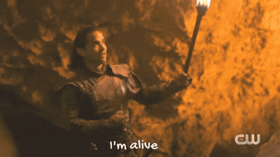 A Man Holding A Torch With The Words I 'M Alive On The Bottom GIF