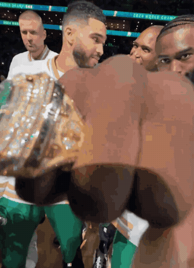 A Man Holding A Trophy That Says World Champion GIF