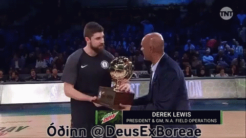 A Man Holding A Trophy With Derek Lewis On The Bottom GIF