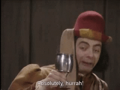 A Man Holding A Wine Glass With The Words Absolutely Hurrah Written Below Him GIF