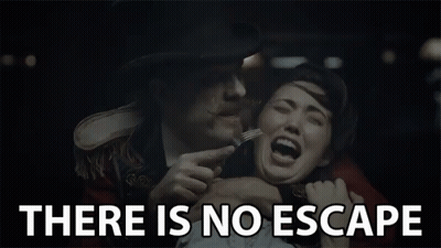A Man Holding A Woman With A Fork And The Words " There Is No Escape " Behind Him GIF