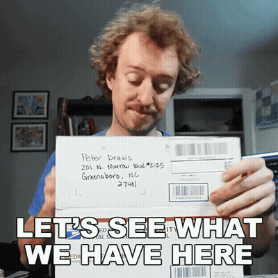 A Man Holding An Envelope Addressed To Peter Draws In Greensboro Nc GIF