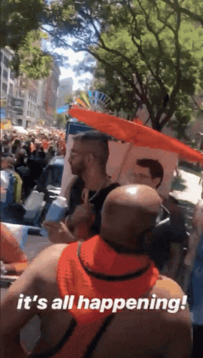 A Man Holding An Umbrella Says It 'S All Happening ! GIF