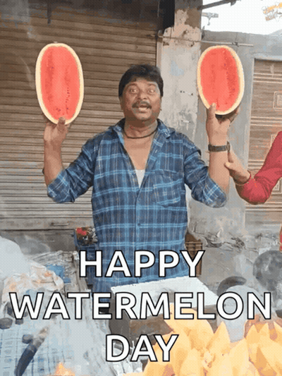 A Man Holding Two Slices Of Watermelon With The Words Happy Watermelon Day Written Below Him GIF