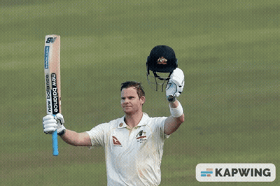 A Man Holding Up A New Balance Bat GIF