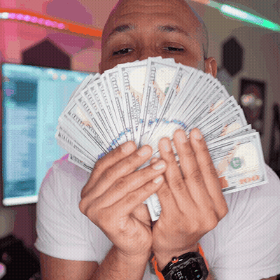 A Man Holds A Fan Of Twenty Dollar Bills GIF