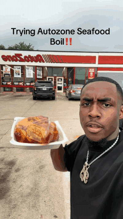 A Man Holds A Tray Of Food In Front Of A Smosh Shop GIF