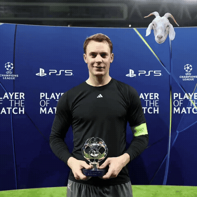 A Man Holds A Trophy In Front Of A Ps5 Banner GIF