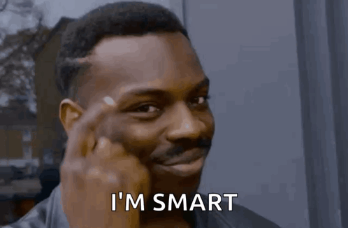 A Man Holds His Finger To His Forehead With The Words I 'M Smart Above Him GIF