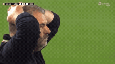 A Man Holds His Head In His Hands While Watching A Soccer Game GIF