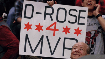 A Man Holds Up A Sign That Says " D-Rose 4 Mvp " GIF