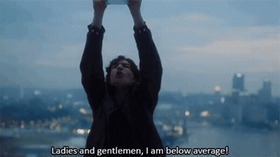 A Man Holds Up His Arms In The Air And Says " Ladies And Gentlemen , I Am Below Average ! " GIF