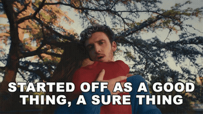 A Man Hugging A Woman With The Words Started Off As A Good Thing A Sure Thing Below Him GIF