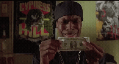A Man In A Bandana Is Holding A Dollar Bill In His Hands . GIF
