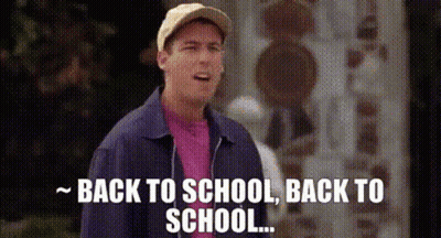A Man In A Baseball Cap And Jacket Is Standing In Front Of A Building And Saying `` Back To School , Back To School . '' GIF