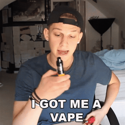 A Man In A Baseball Cap Is Holding A Vape Device And Says I Got Me A Vape GIF