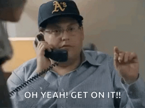 A Man In A Baseball Cap Is Talking On A Telephone And Says `` Oh Yeah ! Get On It ! '' GIF