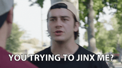 A Man In A Baseball Cap Is Talking To Another Man And Says You Trying To Jinx Me GIF