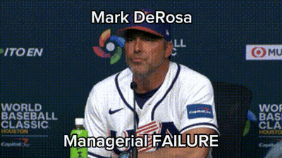 A Man In A Baseball Uniform Is Sitting In Front Of A Microphone With The Words Mark Derosa Managerial Failure Below Him GIF
