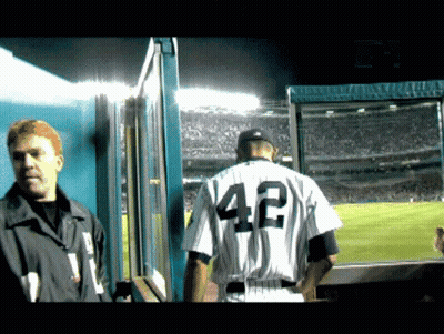 A Man In A Baseball Uniform With The Number 42 On It GIF