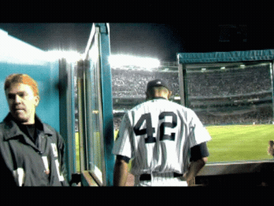A Man In A Baseball Uniform With The Number 42 On The Back GIF