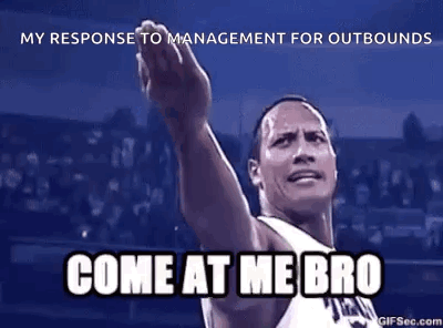 A Man In A Basketball Uniform Is Pointing Up With His Hand . GIF