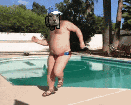 A Man In A Bathing Suit And Hat Is Running By A Swimming Pool GIF
