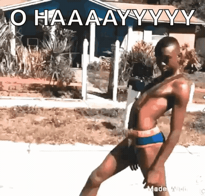 A Man In A Bathing Suit Is Standing In Front Of A House With The Words O Haaaayyy Written On It GIF