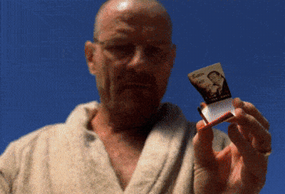 A Man In A Bathrobe Is Holding A Cigarette Pack With A Picture Of A Man On It GIF