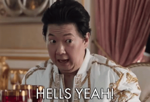 A Man In A Bathrobe Says " Hells Yeah " While Sitting On A Couch GIF