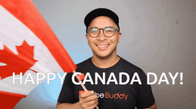 A Man In A Be Buddy Shirt Holds A Canadian Flag And Says Happy Canada Day GIF