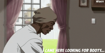 A Man In A Beanie Is Standing In Front Of A Window In A Living Room Looking For Booty . GIF