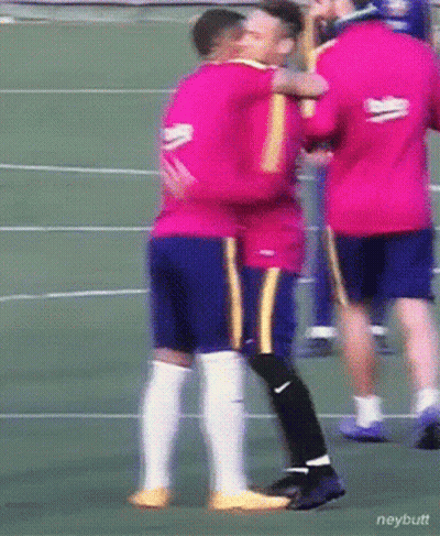 A Man In A Beko Jersey Hugging Another Man On A Soccer Field GIF