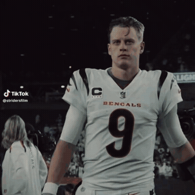 A Man In A Bengals Jersey With The Number 9 On His Chest GIF