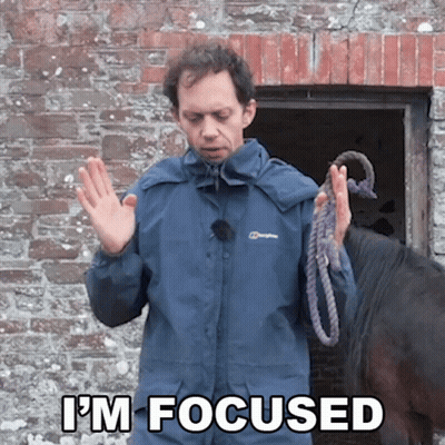 A Man In A Berghaus Jacket Holds A Rope In Front Of A Horse And Says " I 'M Focused " GIF