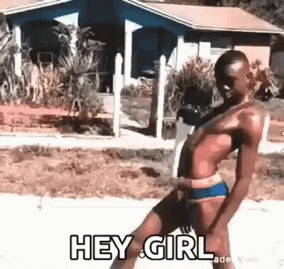 A Man In A Bikini Is Dancing On A Sidewalk And Says `` Hey Girl '' . GIF