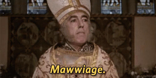 A Man In A Bishop 'S Hat Is Saying Mawwiage In Front Of A Stained Glass Window . GIF