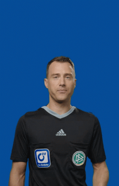 A Man In A Black Adidas Shirt Is Holding A Yellow Card GIF