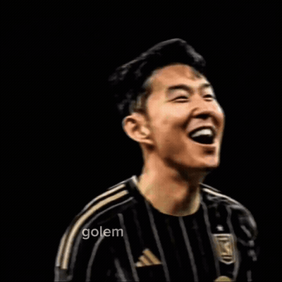 A Man In A Black And Gold Striped Shirt With The Word Son On It GIF