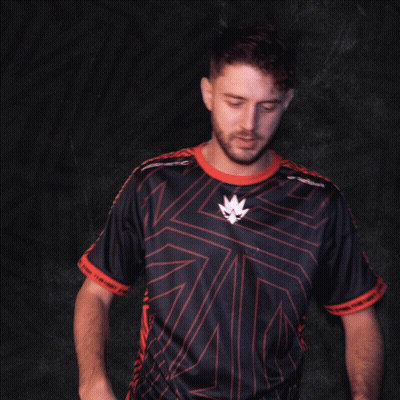 A Man In A Black And Red Shirt With A Leaf On The Front GIF