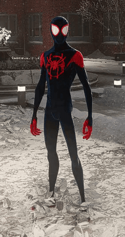 A Man In A Black And Red Spider-Man Suit Is Standing In The Snow GIF