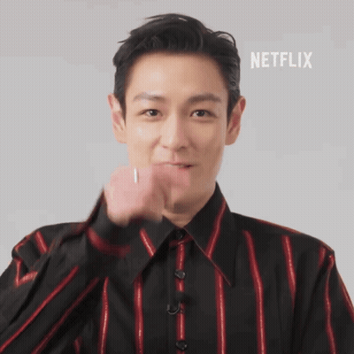 A Man In A Black And Red Striped Shirt With Netflix Written On The Bottom Right GIF